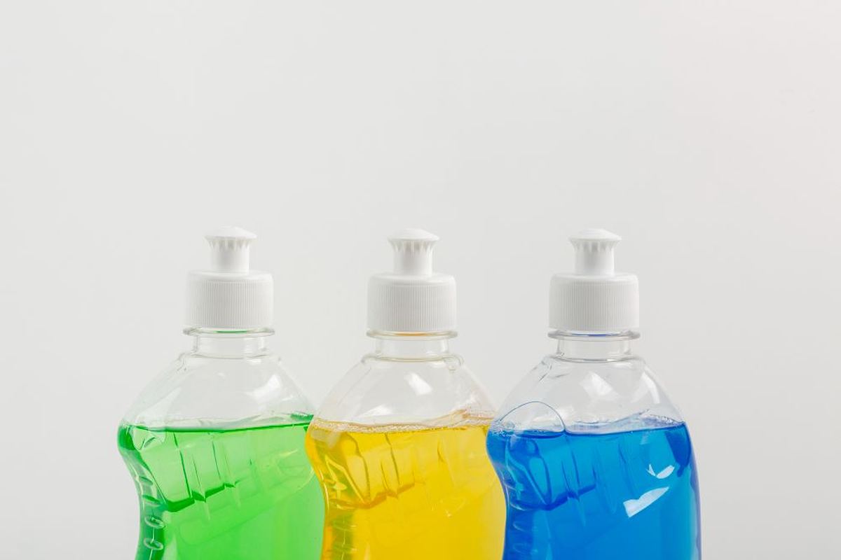 Green, yellow and blue dishwashing liquid bottles, representing the detergent and cleaning chemicals range supplied by Mwembeshi Chemicals in Zambia