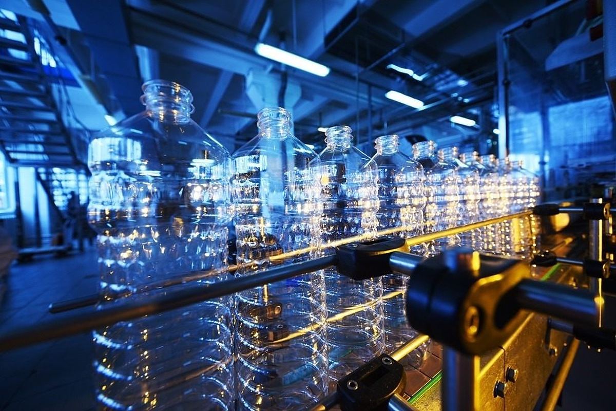 Plastic bottles moving through an industrial production line